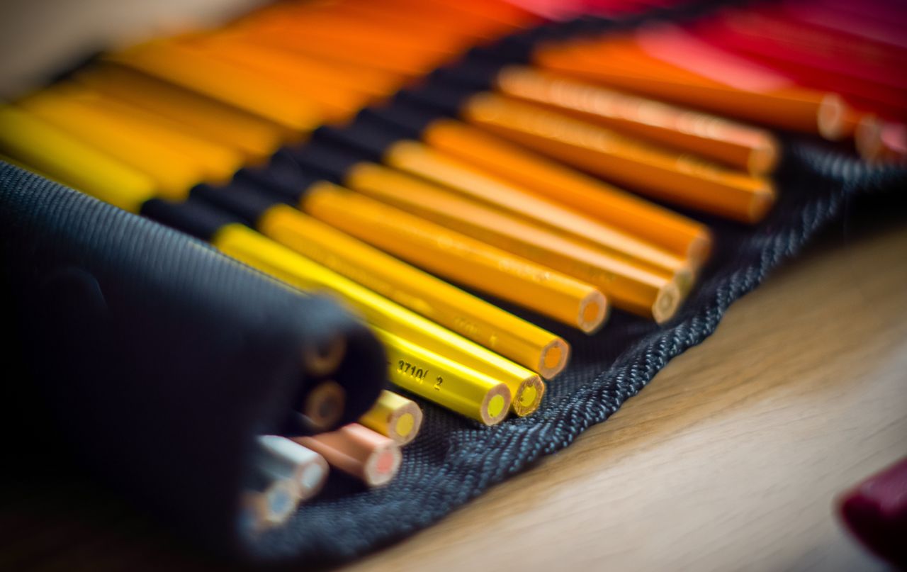 testimonial-img Close-up of neatly arranged vibrant colored pencils for artistic creativity.