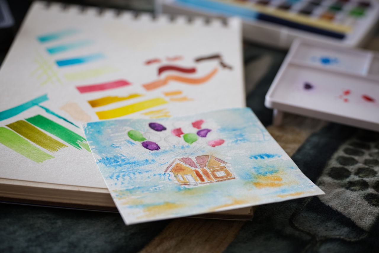 Bright watercolor art with paint and brushes. Ideal for art and education themes.